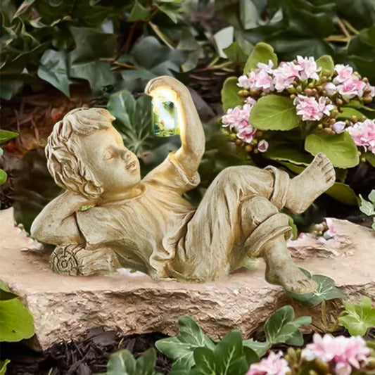 Children's statues with luminous fireflies