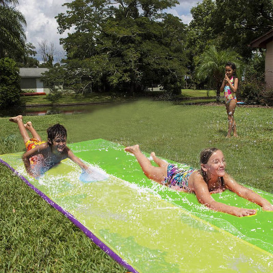 Water slide with inflatable railing