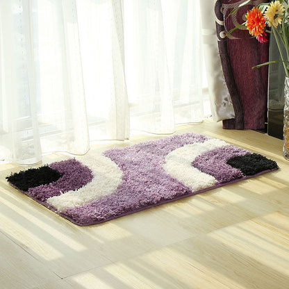 Patterned floor mat in several colours