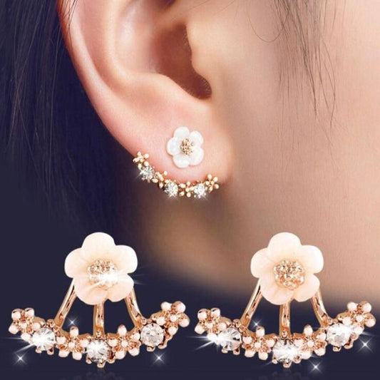 Earrings with daisy and hanging behind design