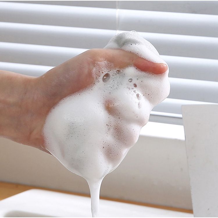 Cleaning sponge in neutral colours