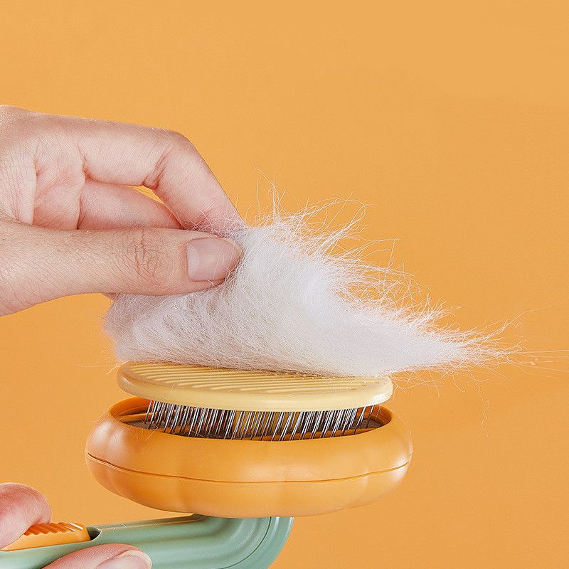 Self-cleaning brush for dogs and cats