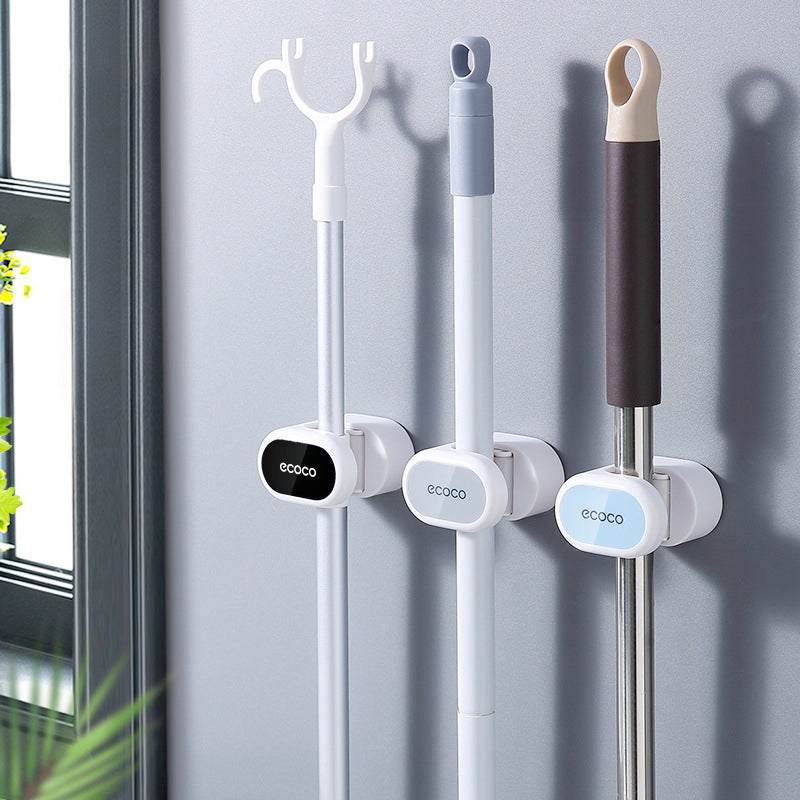 Wall-mounted holder for mops and brooms - keep things organized