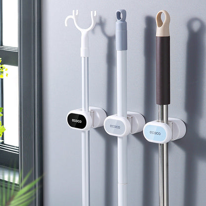 Wall-mounted holder for mops and brooms - keep things organized