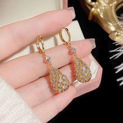 Zircon inlaid carved water drop earrings