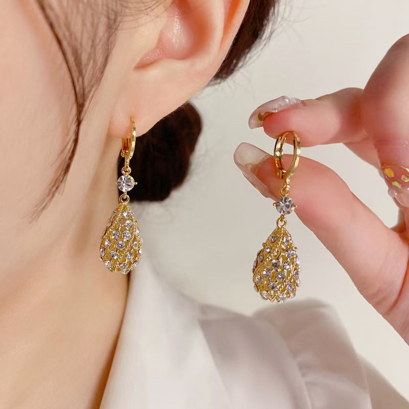 Zircon inlaid carved water drop earrings