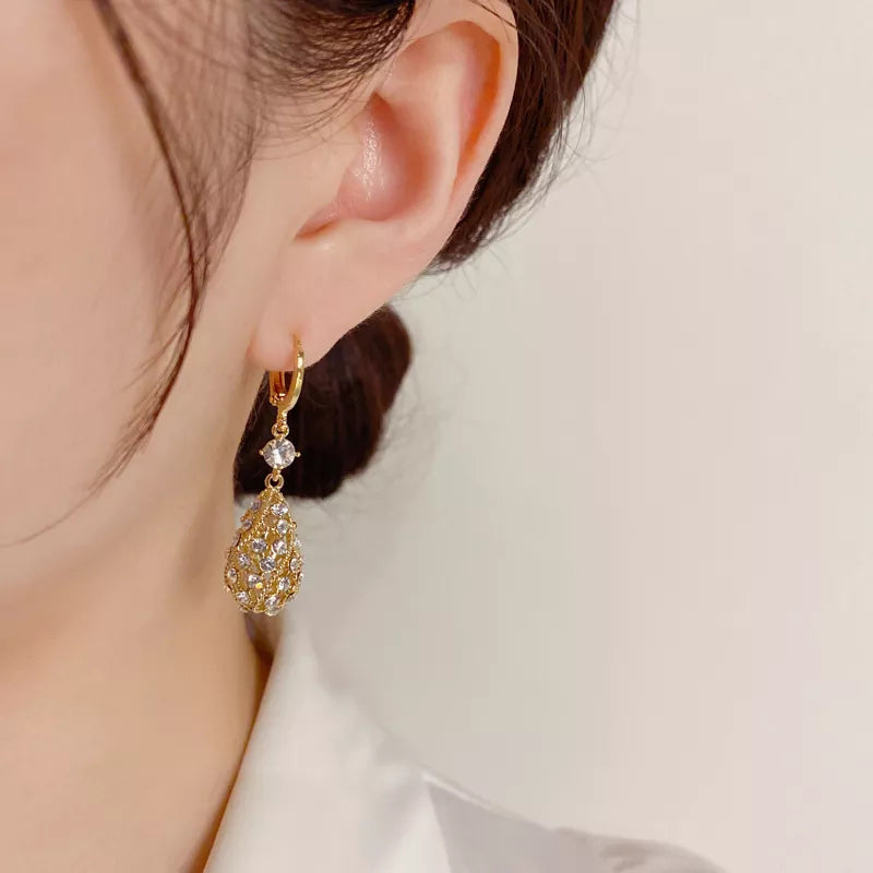 Zircon inlaid carved water drop earrings