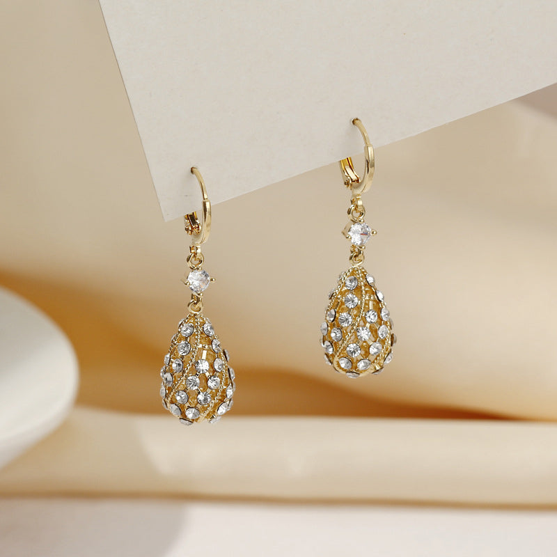 Zircon inlaid carved water drop earrings