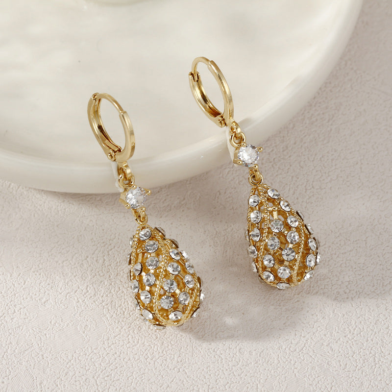 Zircon inlaid carved water drop earrings