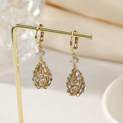 Zircon inlaid carved water drop earrings